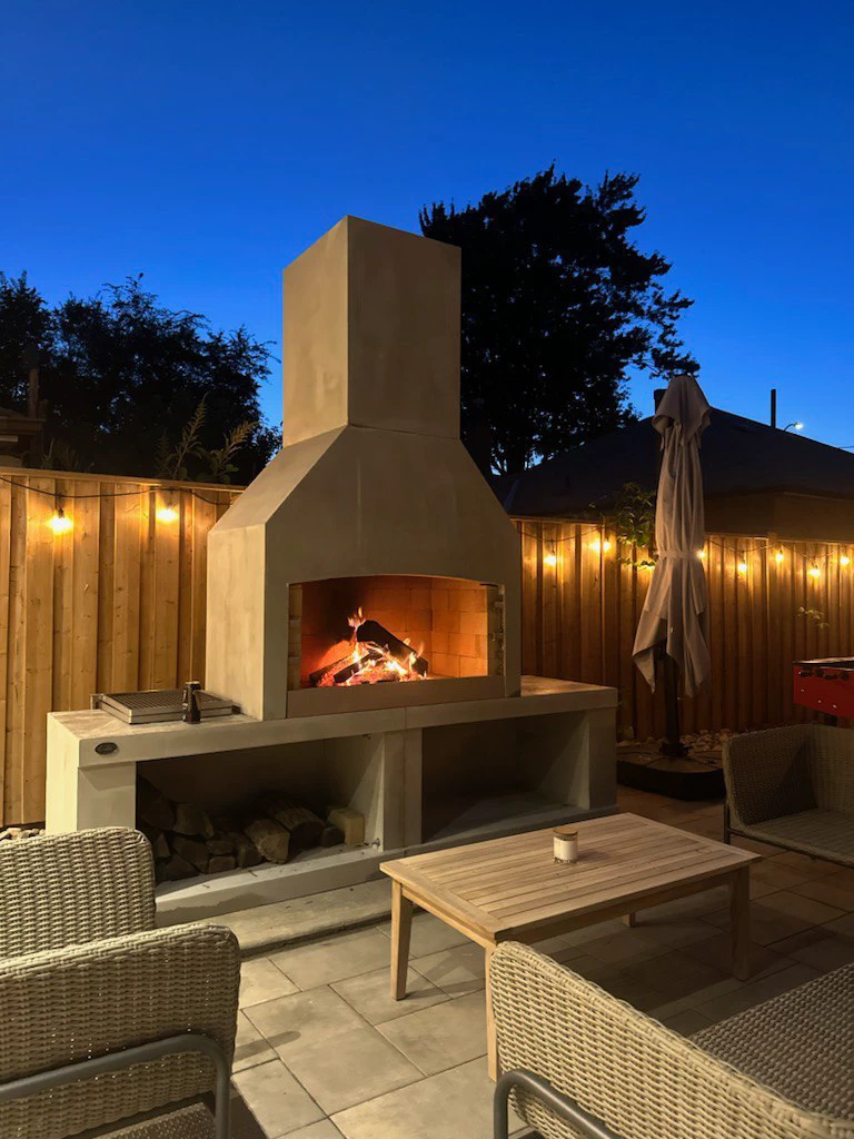 Flare Fires' Executive on a patio at dusk with a fire blazing.