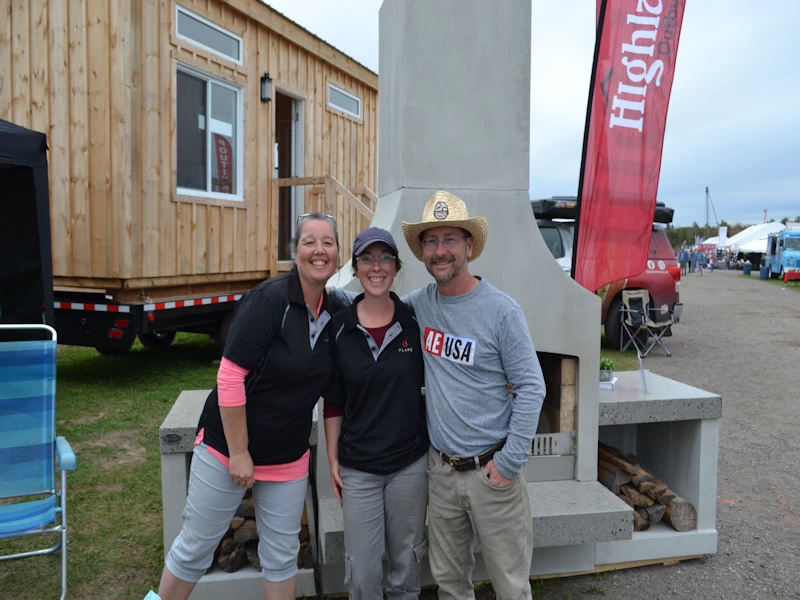Kate, Kristen and Matt in their booth at the International Plowing Match (IPM) 2024 in Lindsay, Ontario